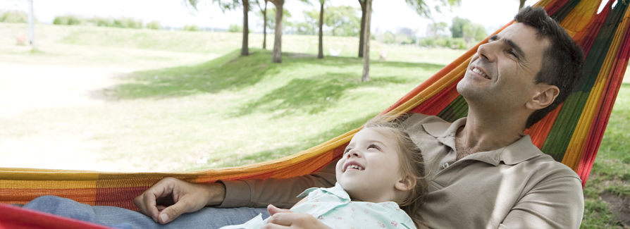 Father and daughter in hammock