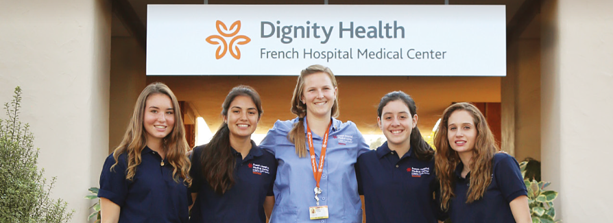 Five female Dignity Health Employees in front of French Hospital