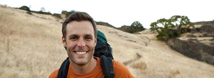 Smiling man hiking 