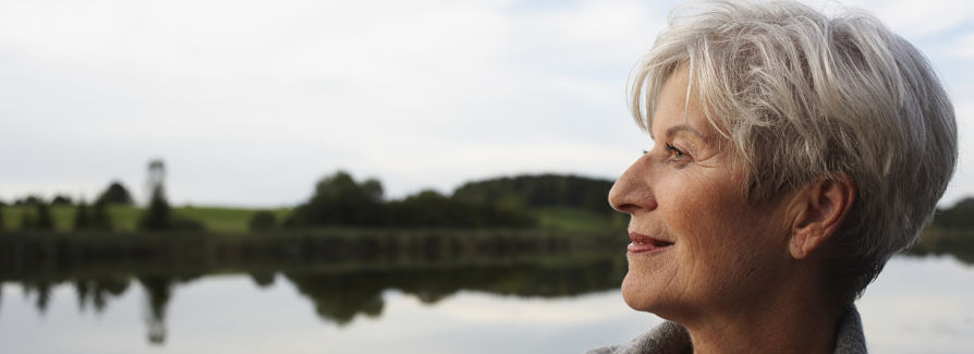 Senior woman at a lake