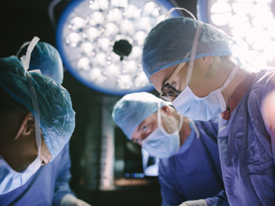 Female and male surgeons in an operating room