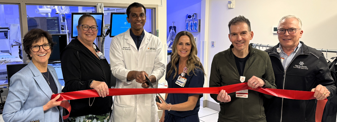 Photo of six hospital leadership at the ribbon cutting ceremony for the new cath lab