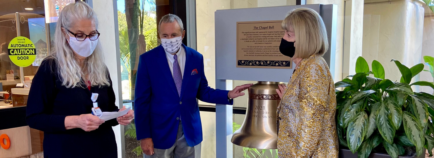 William and Cheryl Swanson with Chaplain Flora Washburn at the dedication of the chapel bell
