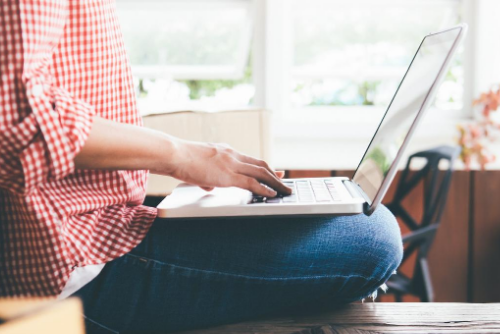 Woman looking at laptop