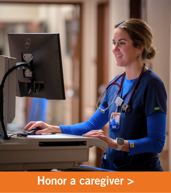 Image of a female working on a computer. Copy reads "Honor a caregiver".