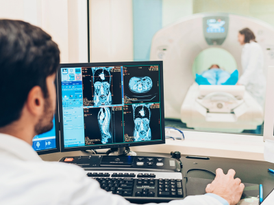 Hospital tech reviewing imaging