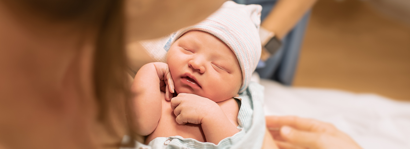 A mother holds her newborn baby A mother holds her newborn baby