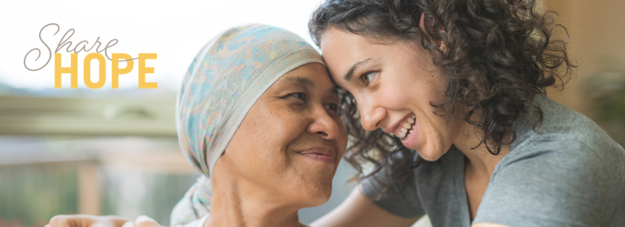 Image of middle age female cancer patient with her adult daughter. 